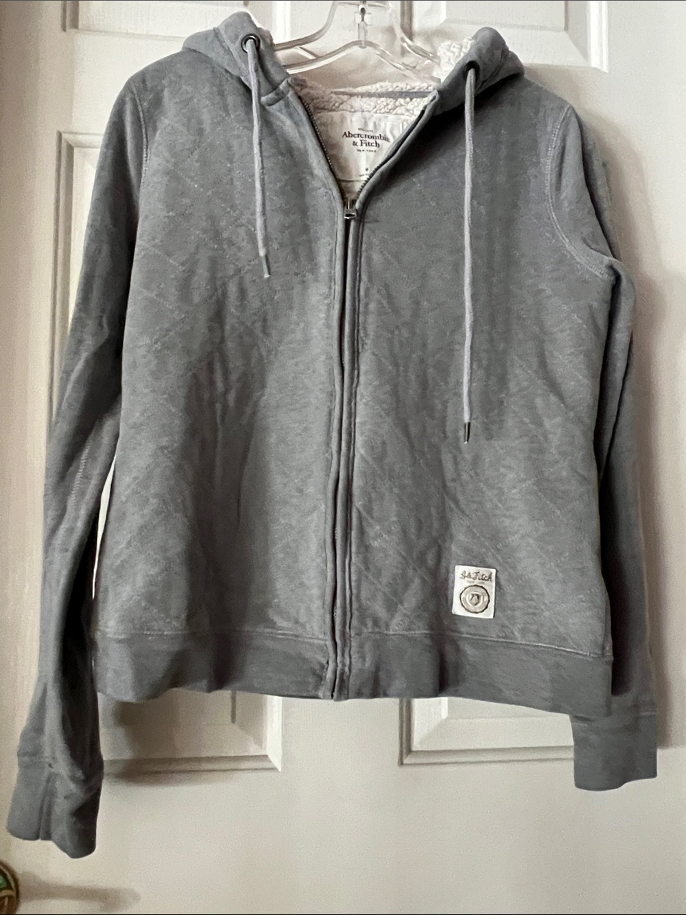 Abercrombie n Fitch ( NY )
    (hooded zip up jacket )